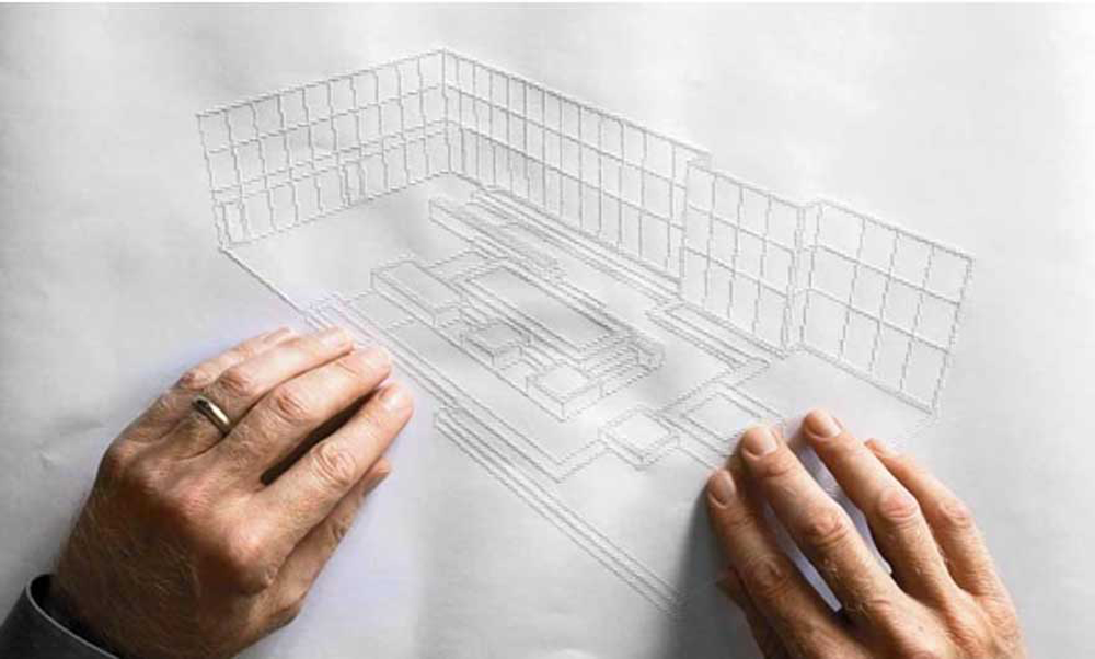 A man is using both of his hands to feel the raised lines of an architectural drawing.